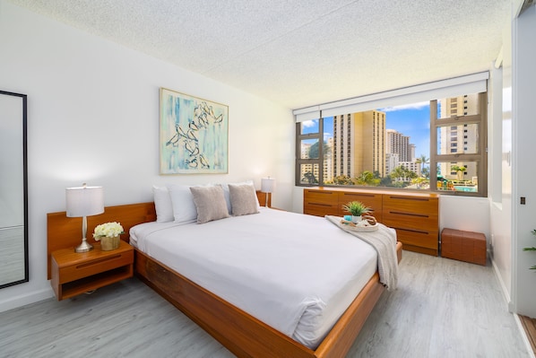 Bedroom with King-size bed, night stands and dresser
