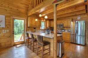 Kitchen Bar seating for 3 - door to deck with stairs to parking area