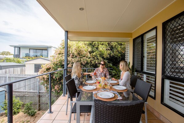 Equipped with alfresco dining, this balcony is the perfect place for happy hour!