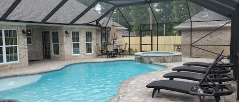 Private pool & Spa with screen enclosure.