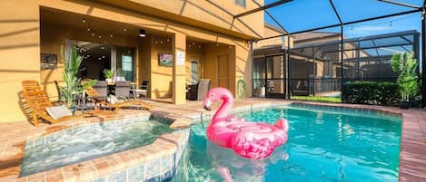 Private Heated Pool and spa in a screened in backyard.