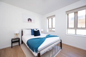 [Bedroom] Bedroom with a double-bed and wide windows.