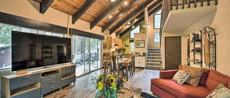 Open concept living/dining/kitchenCathedral knotty pine ceilings