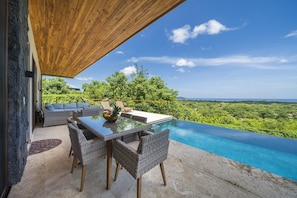 Dining area at the Private infinity edge pool