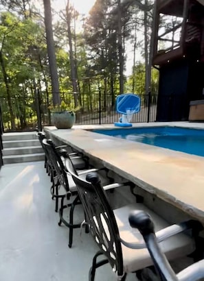 Enjoy a cocktail at the pool bar.