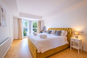 Master bedroom with deep memory foam topped superking sized bed.