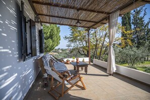 Terrace with 3 person sofa, two deck chairs 