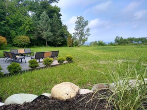 Relax on Bluestone Patio With Wood Firepit While Watching Sunset Over Lake 