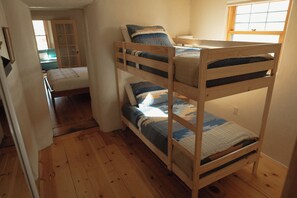 The second bedroom has twin bunks, great for families with kids.