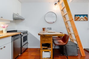 Kitchen - Fully equipped for home cooking, brand new stainless steel appliances, leather barstools, wooden bar.