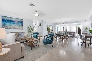 View of open floor plan living room and beyond from the front door.
