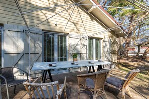 The terrace's stylish design complements the house's decor. 