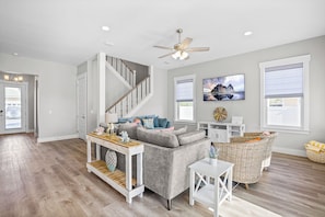Come on in and enter into the open format, coastal great room!