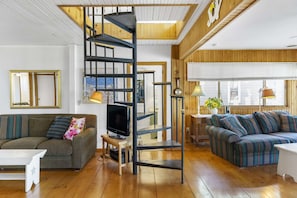 Head up a spiral staircase to find to find a king bed and a fun twin loft that the kids will love.