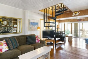 This 2-story beach cottage features 2 bedrooms and 1 full bath.