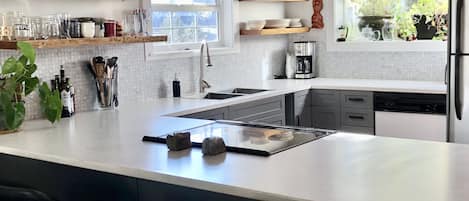 Bright morning sun kitchen. Straddle up to the counter. 5 stools to choose from.