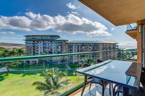 Southern resort view over large grassy area from the lanai.