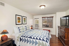 Primary Bedroom with 1 King Bed & Balcony Access