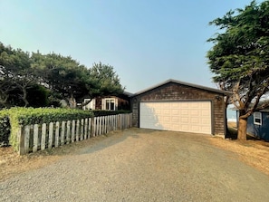 2-car garage with a driveway that can fit 20-ft trailer.