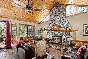 Gather around the dreamy stonewalled fireplace.
