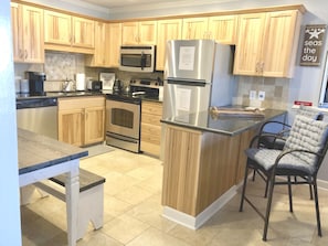 Full size kitchen with all of the amenities of home with seating for 6.