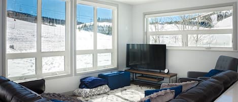 Living room with plenty of seating and spectacular slope-facing views