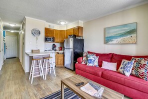 Living Area - From the large, elegant windows to the attractive furniture, you and your guests will love spending time together in this bright and airy living area.