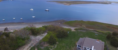 Aerial view of home, the inlet and the outer beach 