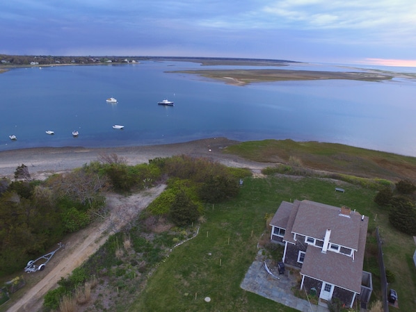 Aerial view of home, the inlet and the outer beach 