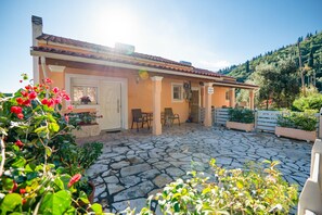 Property entrance and parking area with flower decor