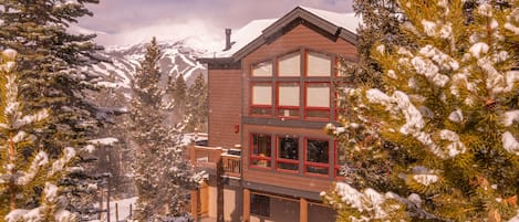 House exterior with ski area in the background