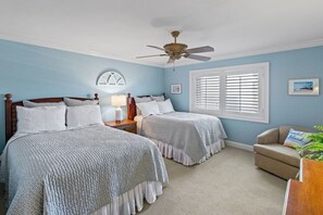 Guest bedroom featuring two comfy beds