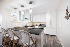 Kitchen with additional bar stool seating