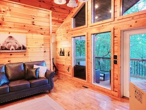 Living Room with View of Outside Deck and Balcony
