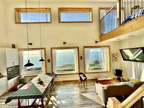 View out the window to your private garden directly on the ocean. Whale watching