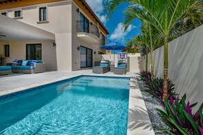 Poolside loungers in our private backyard