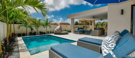 Private backyard with pool, kitchenette (incl. BBQ), lounging & dining areas