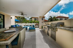 Private backyard with pool, kitchenette (incl. BBQ), lounging and dining areas
