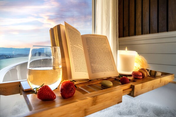 A Tub with a Story. You don’t just see the mountains here - you feel them. Soak in comfort while the peaks and valleys unfold before you - silent, grand, and timeless.