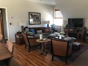 Living room with pull out sofa and satellite TV.
