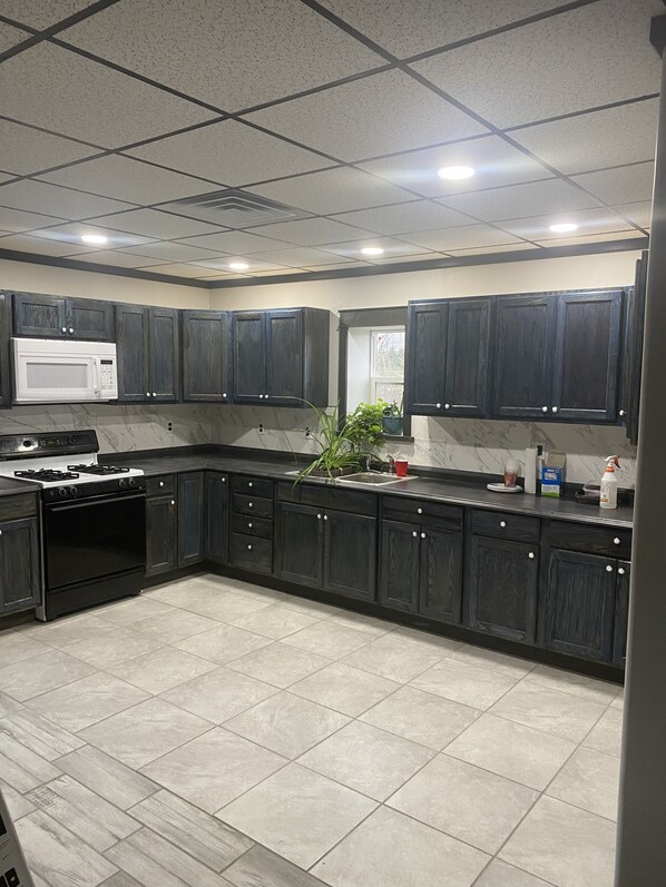 Full extra large kitchen, with coffee maker, toaster, and ice maker.  