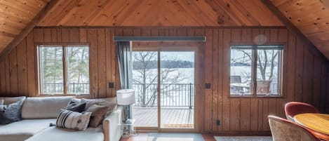 The A-frame highlights the expansive lake views from the back of the cabin.