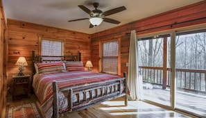 Master bedroom with king size bed and ensuite bathroom.