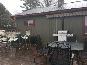 Gas grill, seating for 14, deck overlooking the lake.