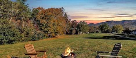 Very large backyard with firepit is a great place to hang out