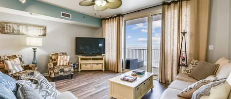 Spacious living room on the 23rd floor with sleeper sofa and access to the balcony