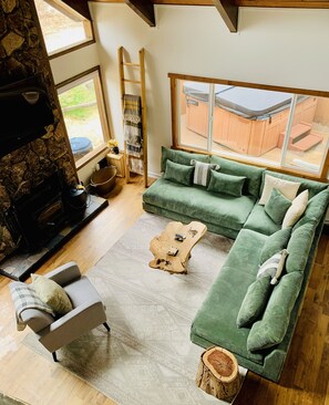 New bigger couch! (Black is the old couch)