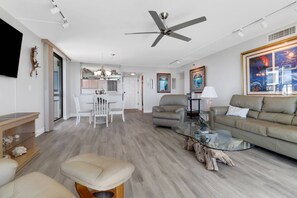 Little details, like a recliner for TV viewing, a nearby bar cart, and marine life artwork make this a space you'll truly enjoy.