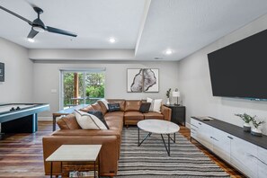 Large leather sectional will be just the spot to watch your favorite movies in the lower level entertainment area