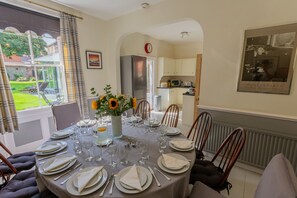 The Dining Room has an oval table with seating for 12 guests.